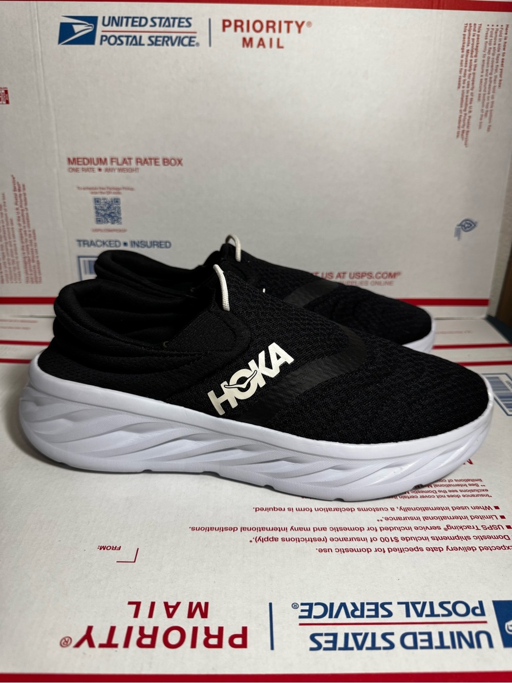 Hoka Black and White Slip-On Running Shoes